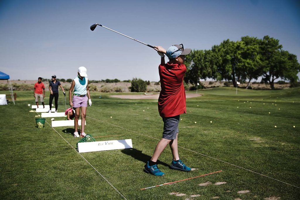 Young golfer at the driving range